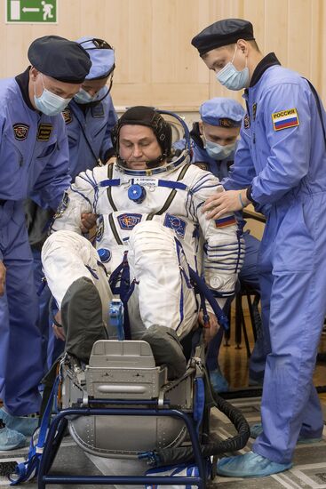 ISS 47/48 prime crew try on space suits, inspect spacecraft