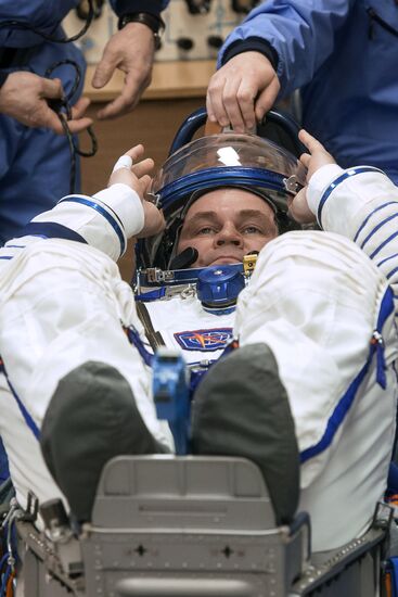 ISS 47/48 prime crew try on space suits, inspect spacecraft