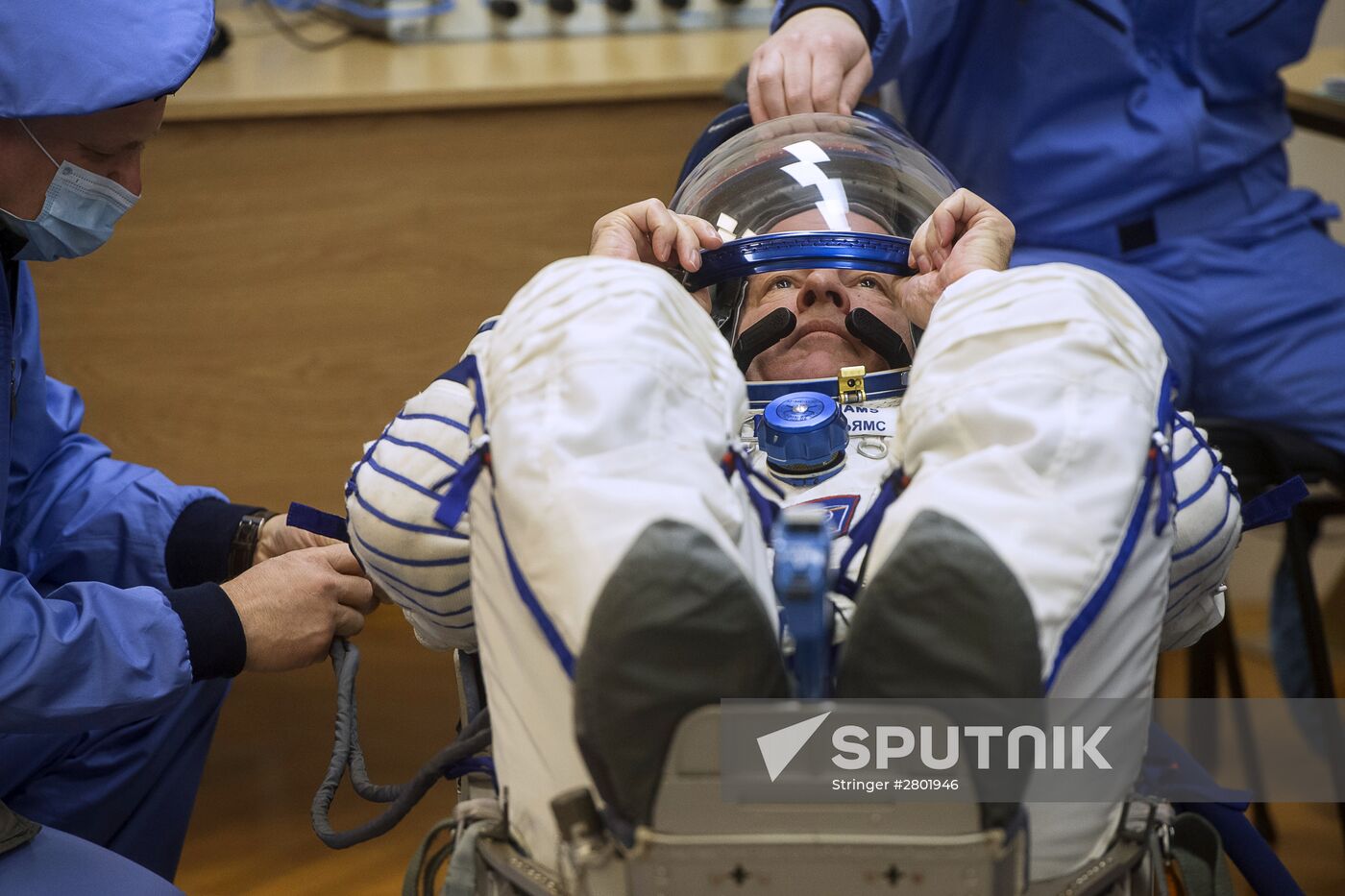 ISS 47/48 prime crew try on space suits, inspect spacecraft
