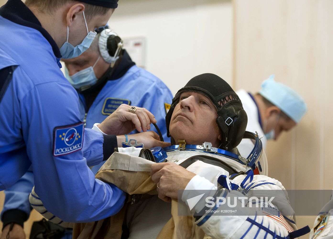 ISS 47/48 prime crew try on space suits, inspect spacecraft