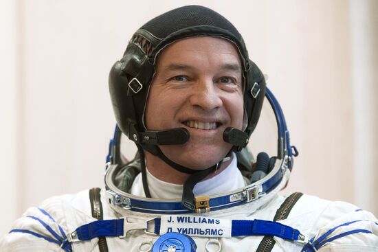 ISS 47/48 prime crew try on space suits, inspect spacecraft