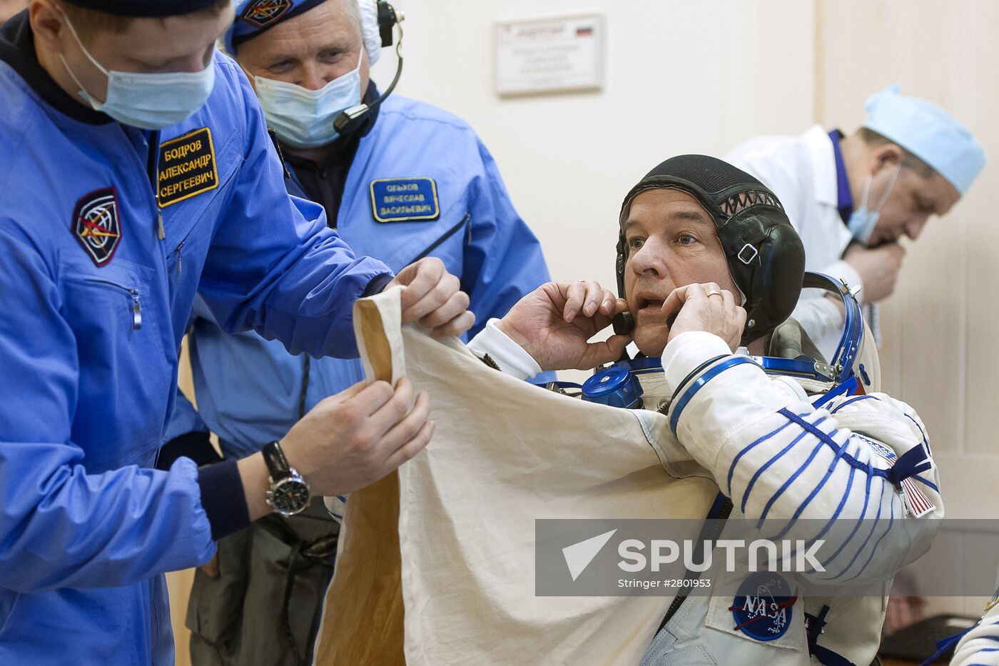 ISS 47/48 prime crew try on space suits, inspect spacecraft