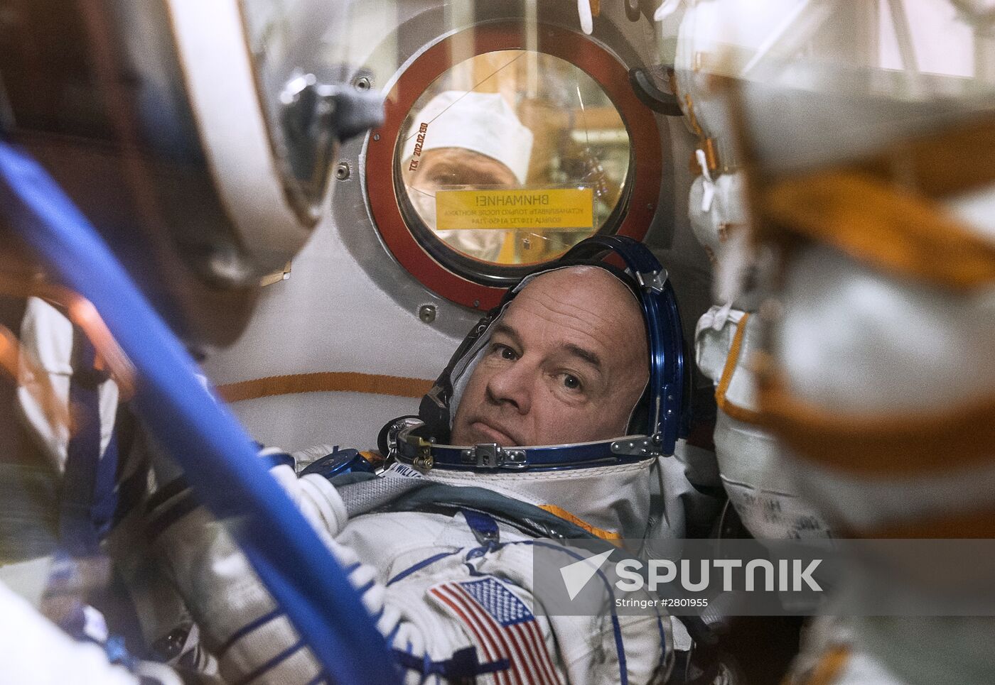 ISS 47/48 prime crew try on space suits, inspect spacecraft