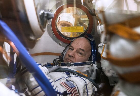 ISS 47/48 prime crew try on space suits, inspect spacecraft