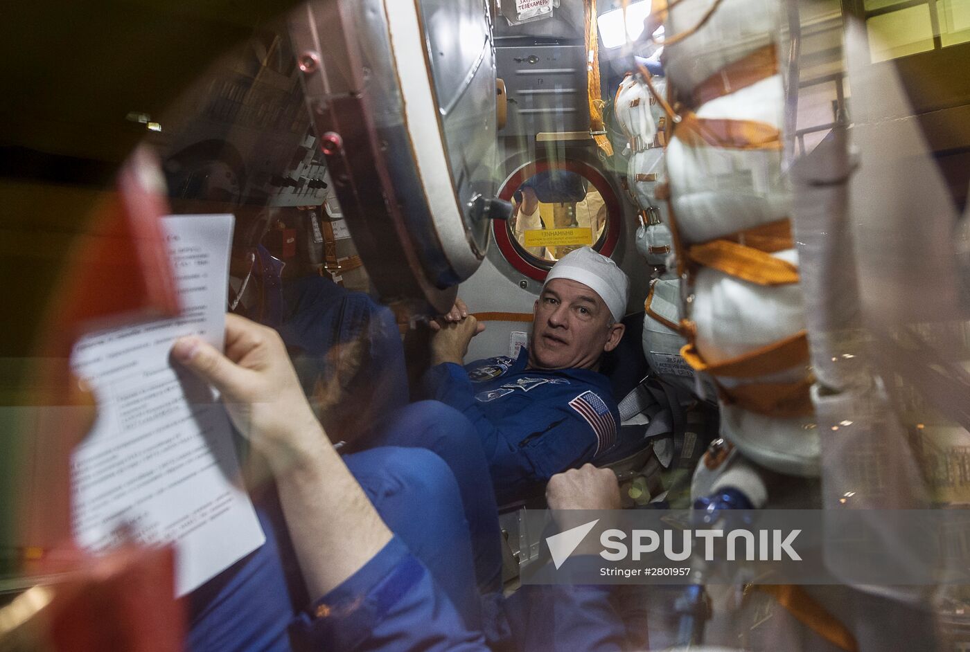 ISS 47/48 prime crew try on space suits, inspect spacecraft