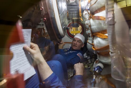 ISS 47/48 prime crew try on space suits, inspect spacecraft