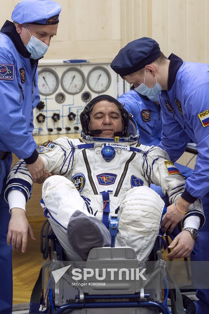 ISS 47/48 prime crew try on space suits, inspect spacecraft