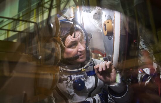ISS 47/48 prime crew try on space suits, inspect spacecraft