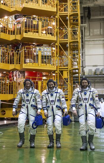ISS 47/48 prime crew try on space suits, inspect spacecraft