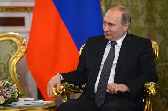 Russian President Vladimir Putin meets with King Mohammed VI of Morocco