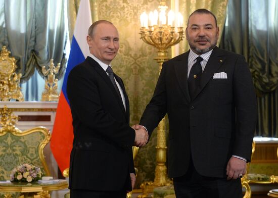 Russian President Vladimir Putin meets with King Mohammed VI of Morocco