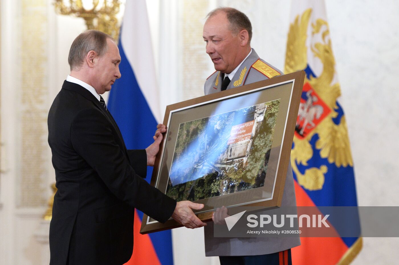 President Vladimir Putin presents state awards to officers who took part in counter-terrorism operation in Syria