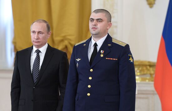 President Vladimir Putin presents state awards to officers who took part in counter-terrorism operation in Syria