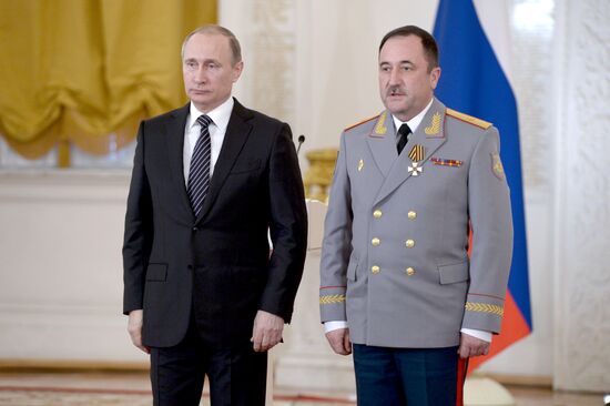 President Vladimir Putin presents state awards to officers who took part in counter-terrorism operation in Syria