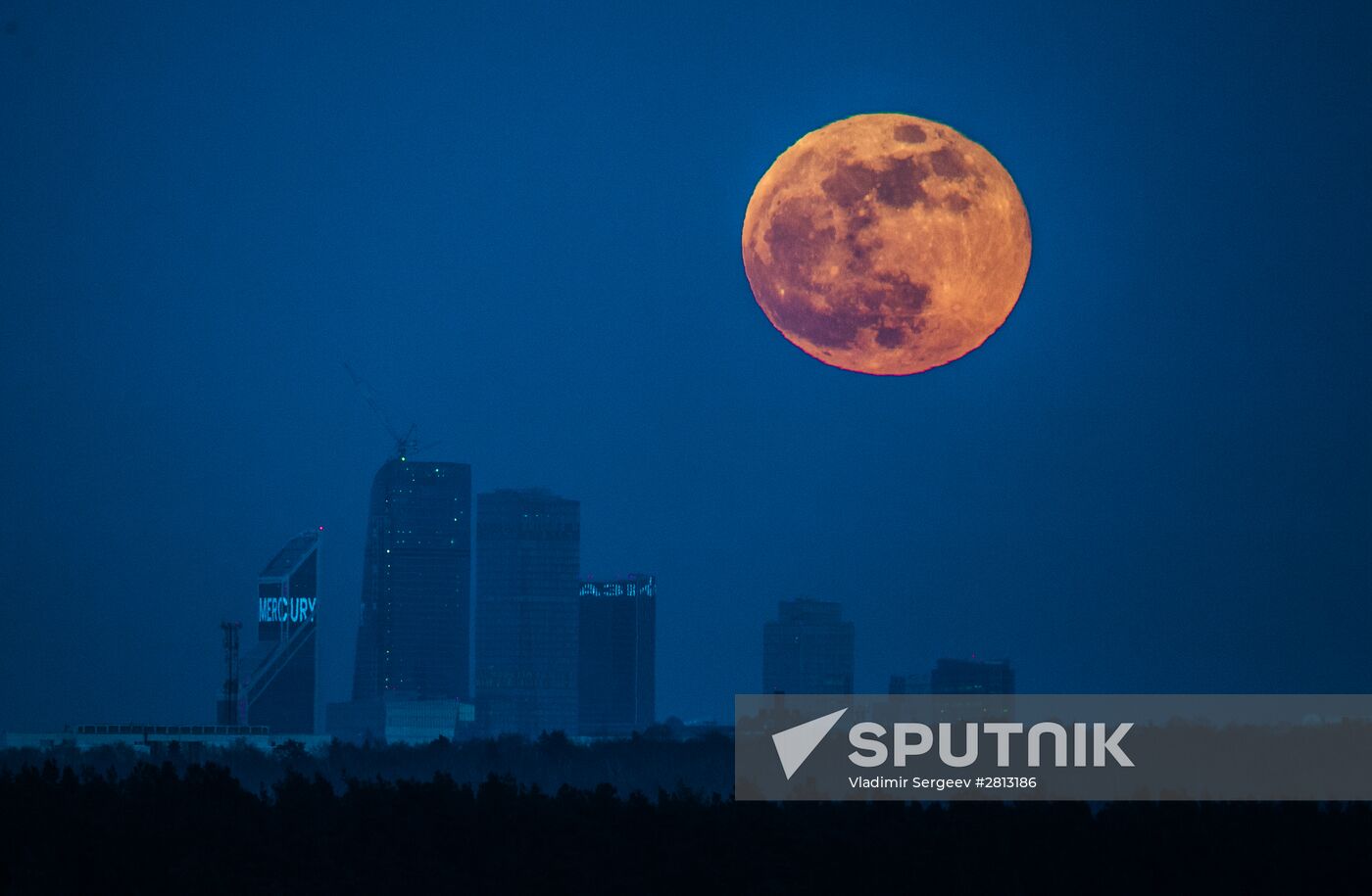 Full moon over Moscow City International Business Center