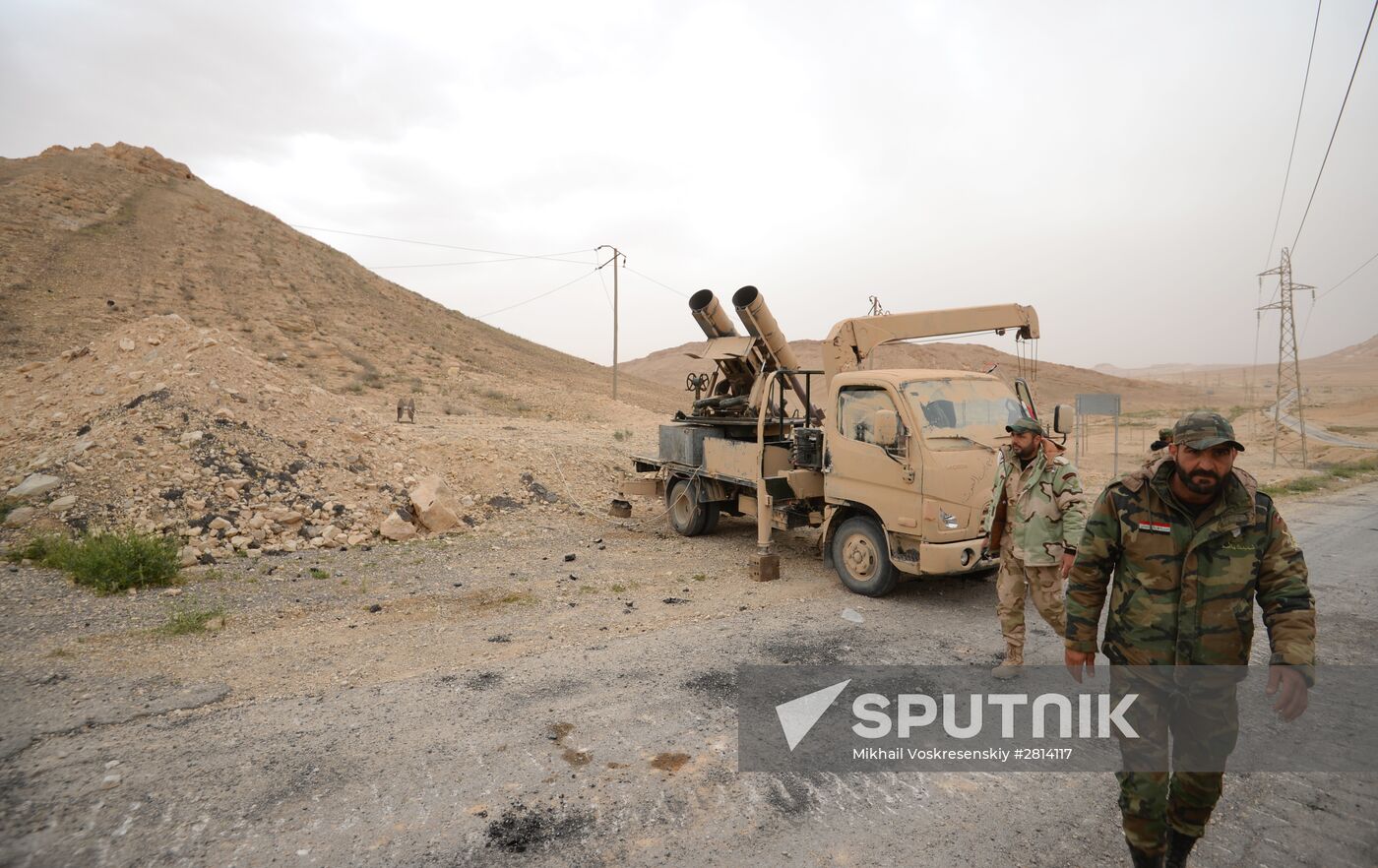 Syrian government army and militia fight for Palmyra