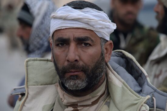 Syrian government army and militia fight for Palmyra