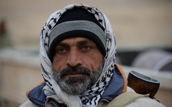 Syrian government army and militia fight for Palmyra