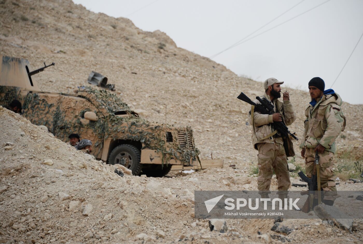 Syrian government army and militia fight for Palmyra