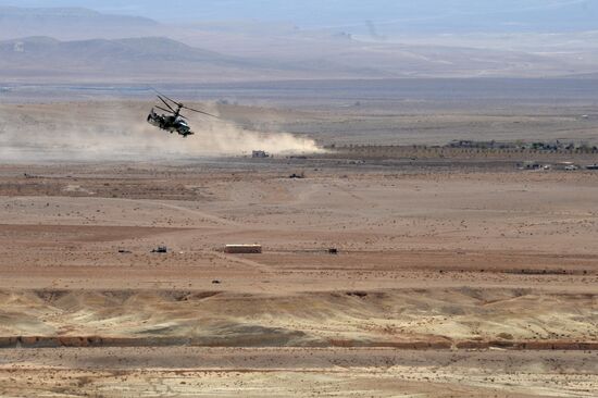 A Kamov Ka-52 Hokum-B attack helicopter hits targets in Syria