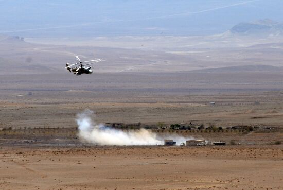 A Kamov Ka-52 Hokum-B attack helicopter hits targets in Syria