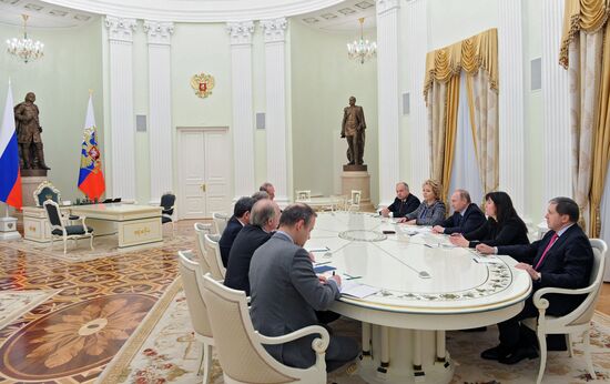 Russian President Vladimir Putin meets with French Senate President Gerard Larcher