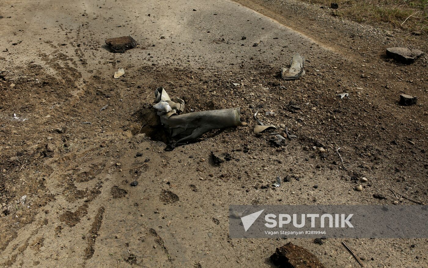 An exploded missile of the Smerch multiple rocket launcher in the Nagorno-Karabakh conflict area. Location: Nagornо-Karabakh. Author: Vagan Stepanyan/Sputnik. Situation near Madagis village in the Karabakh conflict zone