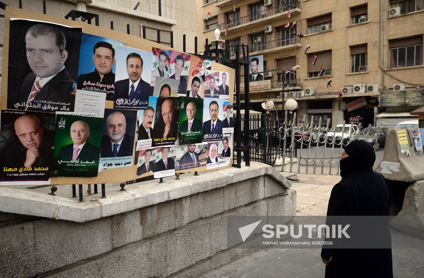 Pre-election posters of candidates for Syrian parliamentary elections