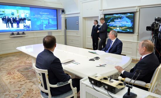 Russian President Vladimir Putin holds videoconference with ISS and Vostochny space center