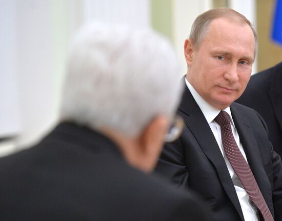 Russian President Vladimir Putin meets with Palestinian Authority President Mahmoud Abbas
