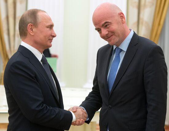 Russian President Vladimir Putin meets with FIFA President Gianni Infantino