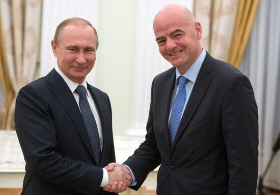 Russian President Vladimir Putin meets with FIFA President Gianni Infantino