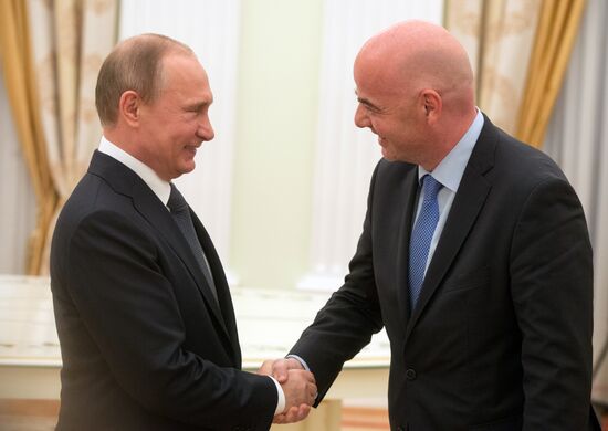 Russian President Vladimir Putin meets with FIFA President Gianni Infantino