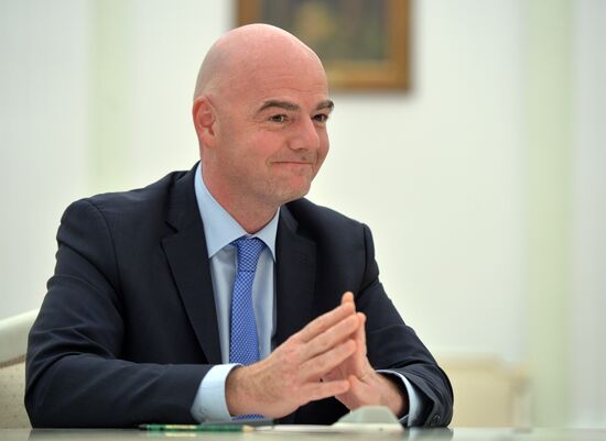 Russian President Vladimir Putin meets with FIFA President Gianni Infantino