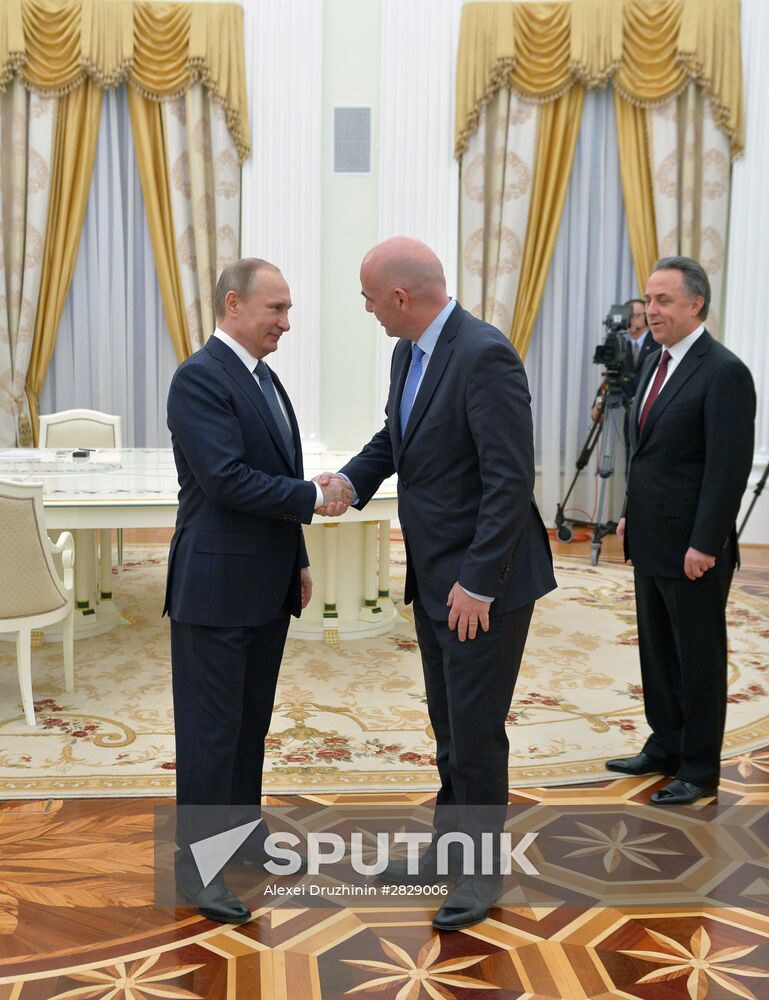 Russian President Vladimir Putin meets with FIFA President Gianni Infantino