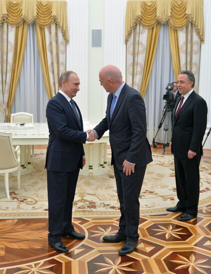 Russian President Vladimir Putin meets with FIFA President Gianni Infantino