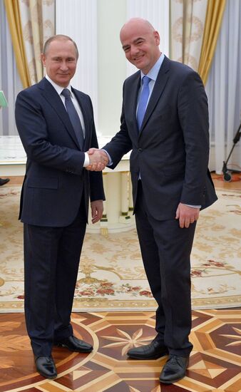 Russian President Vladimir Putin meets with FIFA President Gianni Infantino