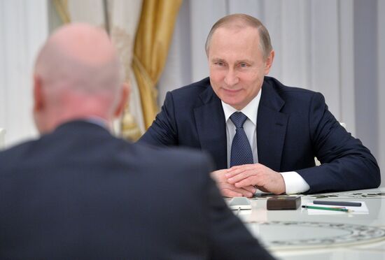 Russian President Vladimir Putin meets with FIFA President Gianni Infantino