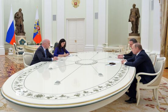 Russian President Vladimir Putin meets with FIFA President Gianni Infantino