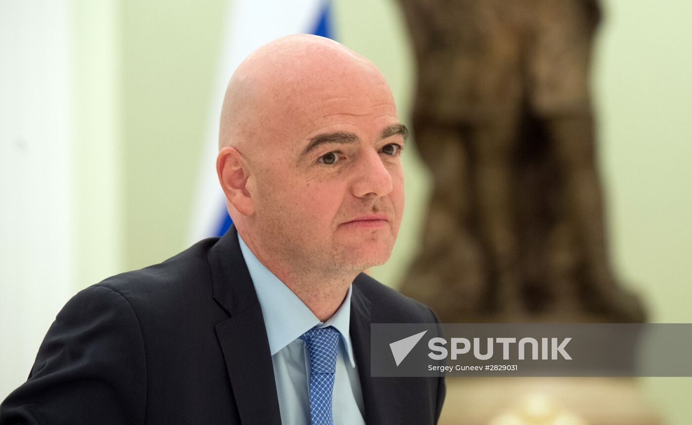 Russian President Vladimir Putin meets with FIFA President Gianni Infantino