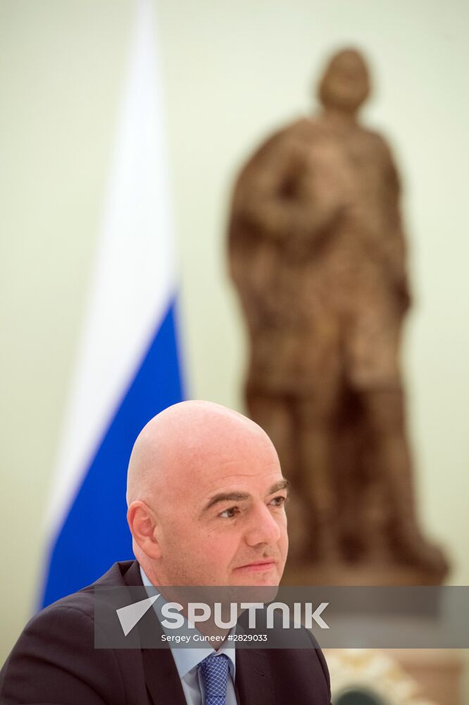 Russian President Vladimir Putin meets with FIFA President Gianni Infantino