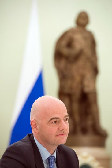 Russian President Vladimir Putin meets with FIFA President Gianni Infantino