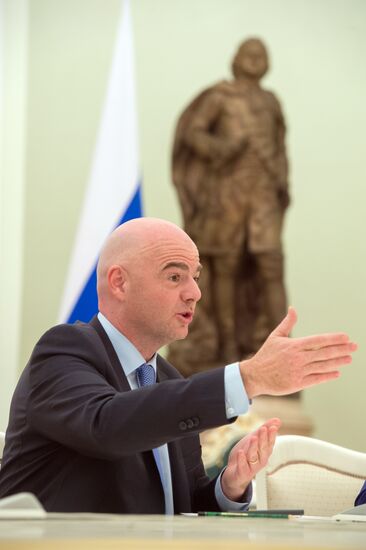 Russian President Vladimir Putin meets with FIFA President Gianni Infantino