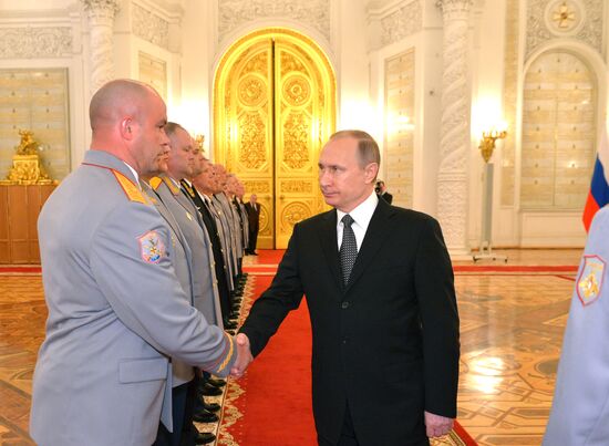 President Vladimir Putin attends intoroduction ceremony for officers appointed to top command posts