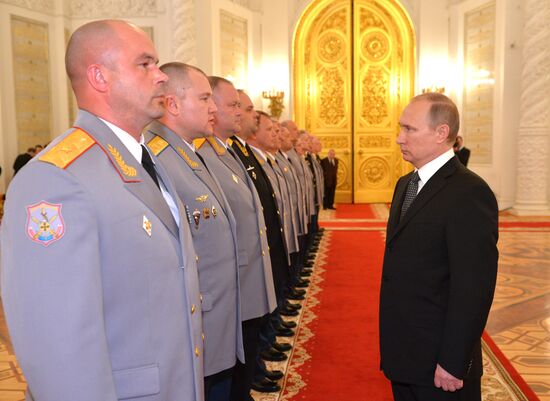 President Vladimir Putin attends intoroduction ceremony for officers appointed to top command posts