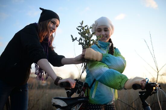 People collect willow branches for Palm Sunday on Lake Shartash in Yekaterinburg