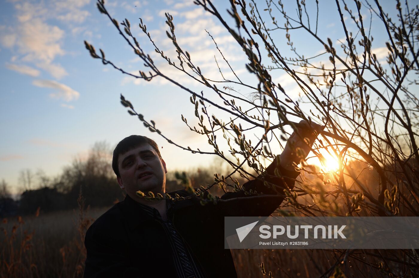 People collect willow branches for Palm Sunday on Lake Shartash in Yekaterinburg