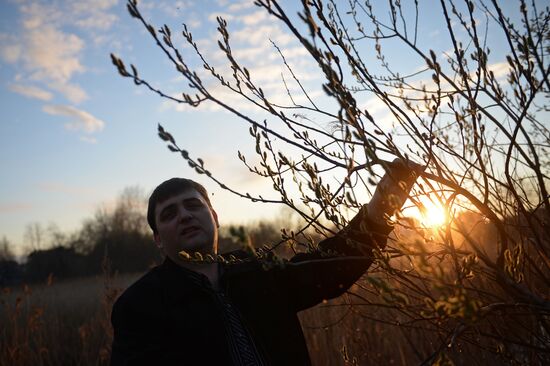People collect willow branches for Palm Sunday on Lake Shartash in Yekaterinburg