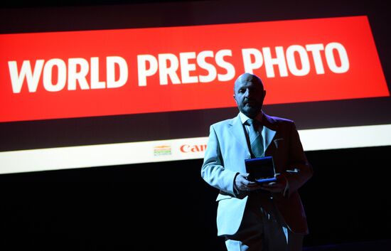 Rossiya Segodnyaya news agency photojournalist Vladimir Presnya awarded World Press Photo