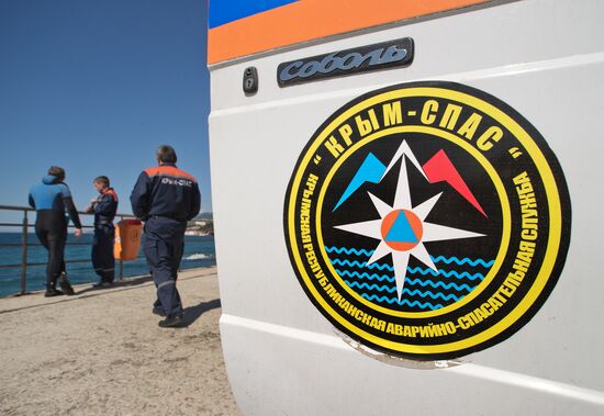 Diver examinsation and bottom cleansing off Crimean beach shore